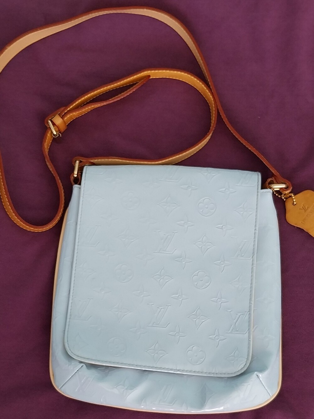 Light Blue Monogram-Embossed Crossbody Bag with Tan Strap